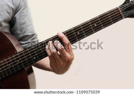Guitar chords,Selective focus,Guitarist,The musicians are catching the guitar chords is B chord full bar on white background
