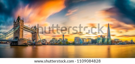 Tower Bridge panorama at sunset in London,. England