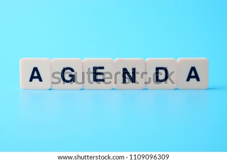 Agenda word on blue background 