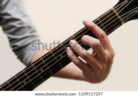Guitar chords,Selective focus,Guitarist,The musician is holding guitar chord on white background,F sharp chord
