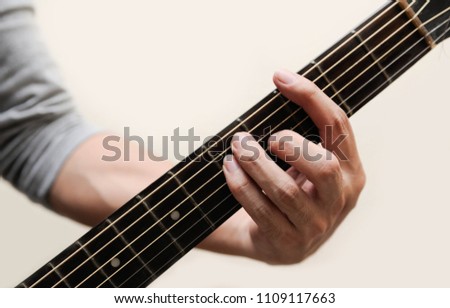 Guitar chords,Selective focus,Guitarist,The musician holding guitar chord on white background,G chord