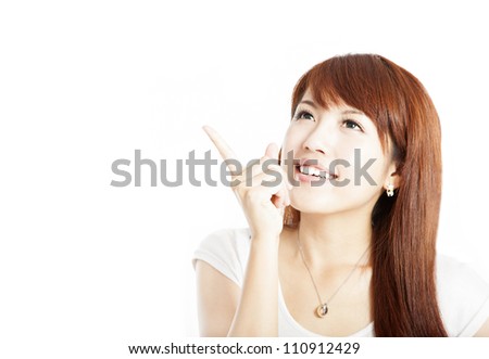 happy young woman pointing at something