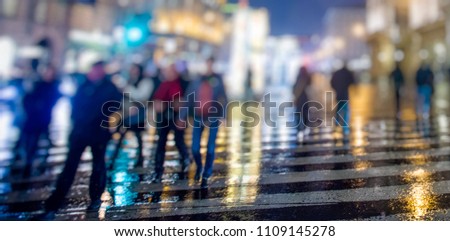 crowd of people on night city streets