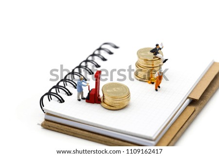 Miniature people : worker team and businessman with coins and credit card,business concept.