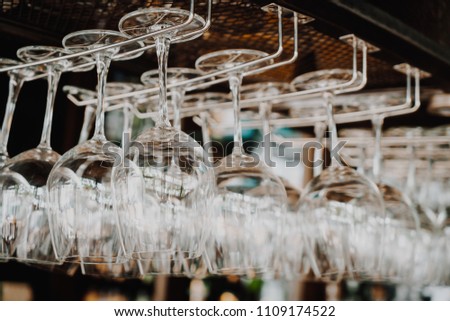 wine glass hanging on shelf - selective focus point