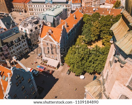 Beautiful aerial Riga view from above with golden rooster on the top of the St. Peters church and old town of Vecriga.