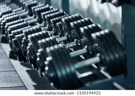 Close up photo of dumbbells in gym, portrait, sport concept, healthy lifestyle, gym concept.