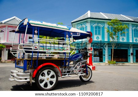 Motorbike trailer is local adapt motorcycle transportation with vintage house background. Royalty-Free Stock Photo #1109200817