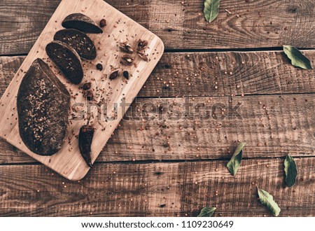 Good and wholesome. High angle shot of freshly baked bread lying on rustic table