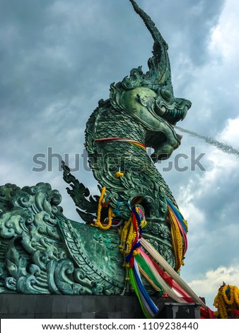 Nak is big snake in asian novel.This is a  sculpture that located on shore of Songkla lake and beautiful landmark of this place.It is show to spray the water from its mouth. 