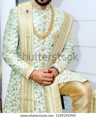 picture of handsome groom dressed in rich ethnic Indian style for a wedding