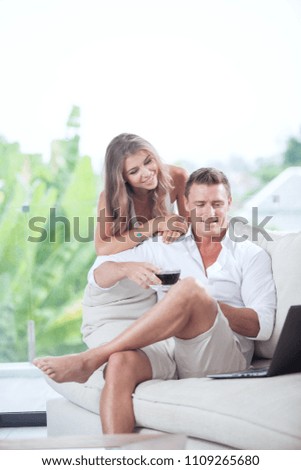 portrait of nice young couple in summer house environment