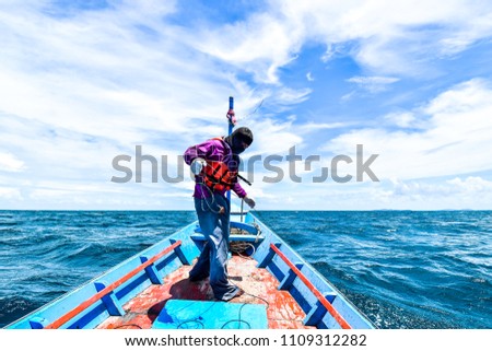 Picture of a fishermen on a boat in gulf of Thailand, Asia
