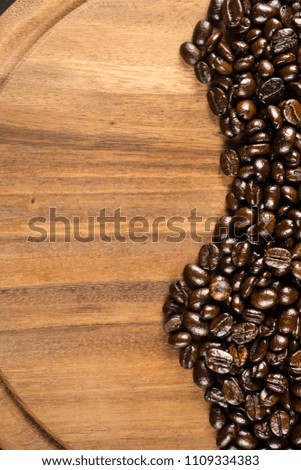 Pictures of coffee beans on wooden backdrop You can decorate it in cafes, equipment, labels, or even for editing purposes.