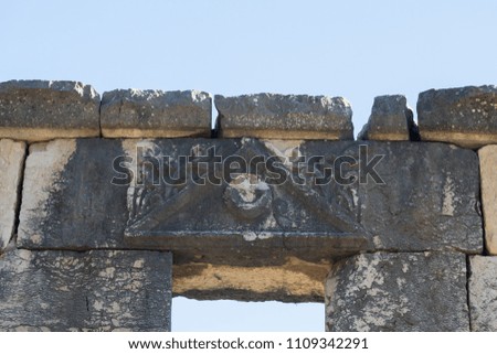 A pattern carved over the entrance to the ruins of the Big Sinagogue of the Talmudic Period in Bar'am National Park in Israel.