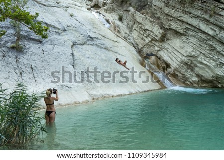 Female model taking pictures at Saint Varvaros lagoon in Greece.
