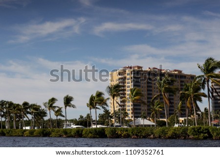 A photo of a generic luxury condominium building in Florida.