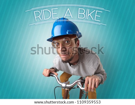 Kooky young guy on a bike with cyclist keywording and streaky background