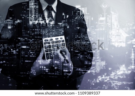 Double exposure of young business man and the city view background to represent successful in investment marketing. Find out the best solution in business and financial as concept.
