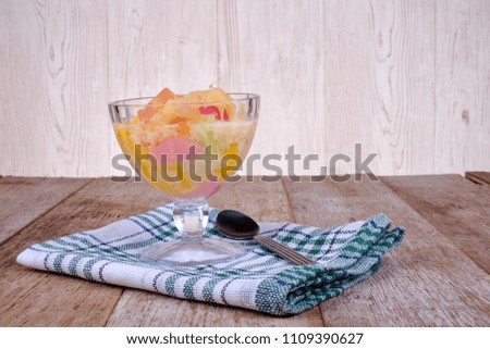 Cocktail pudding with spoon on wooden  table