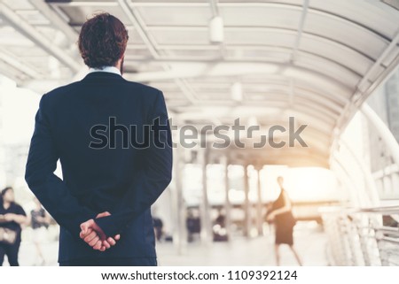 Smart business man standing turn back. Concept of communication.