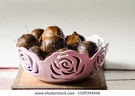 A good composed picture of salak fruits on a basket