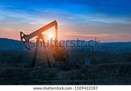 oil pump on orange sunset