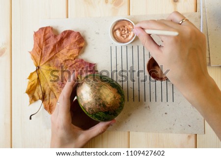 painting of green decorative pumpkin in bronze color, stock photo image