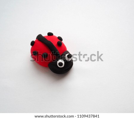 Clay figure: ladybug. Selective focus