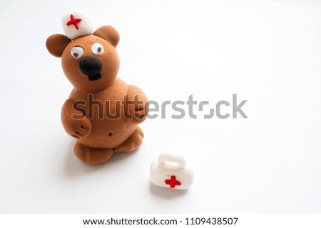 Clay figure: bear doctor. Selective focus 