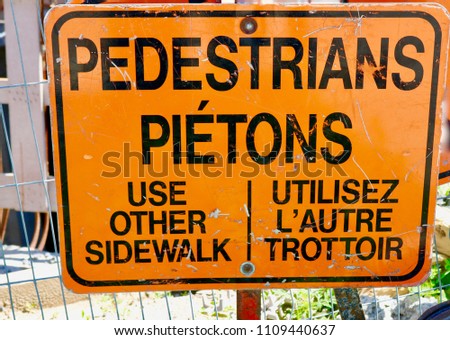 pedestrians use other sidewalk sign