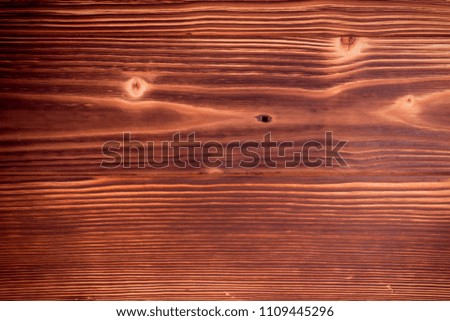 Old dark cherry wood background. Red wooden board plank texture. Beautiful natural rustic photo backdrop for vintage hipster design