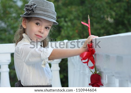 Girl with a rose in his hat