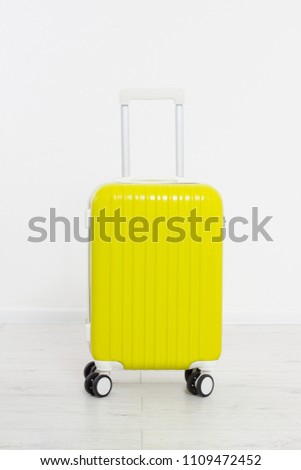 Yellow suitcase isolated on white background .Summer holidays. Travel valise or bag. Mock up. Copy space. Template. Blank.