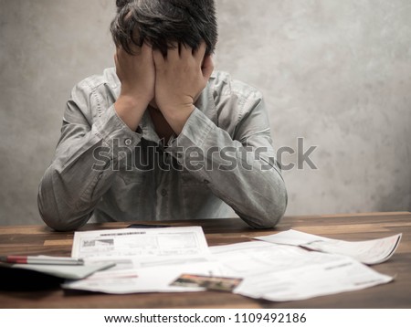 Man having financial problems with invoices and Credit Cards, Money concept., real estate, buy an apartment Royalty-Free Stock Photo #1109492186