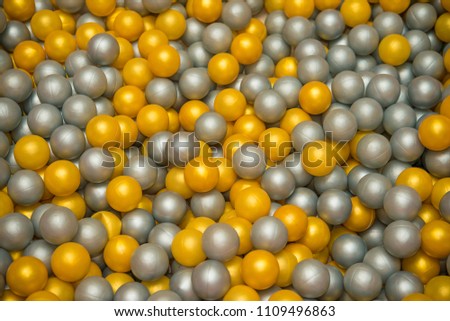 background of many, a lot yellow and gray balls for children playing. 