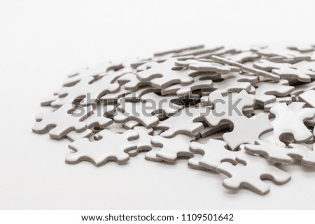 Unfinished white jigsaw puzzle
