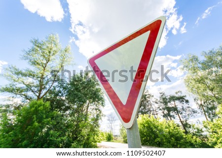 Give way sign on a beautiful background