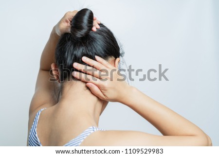 rear view of women tightening the hair, lifestyle concept