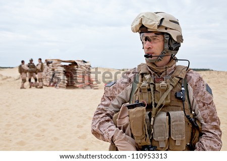 US marines in the desert near the blockpost Royalty-Free Stock Photo #110953313
