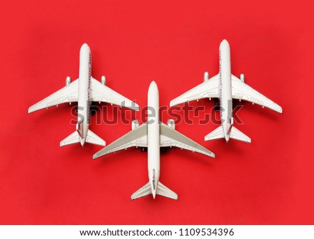 three Air plane toy isolated on red  background. 3 airplane. 