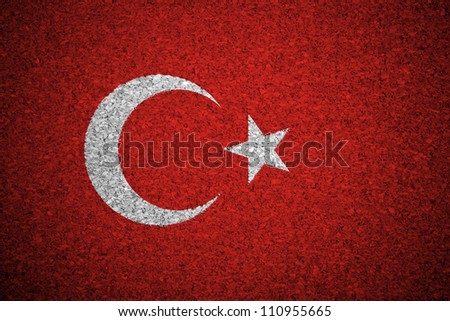 The Turkish flag painted on a cork board.