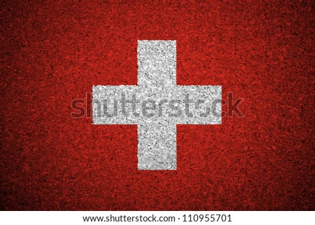 The Swiss flag painted on a cork board.