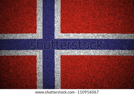The Norwegian flag painted on a cork board.