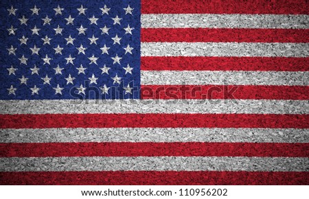 The USA flag painted on a cork board.