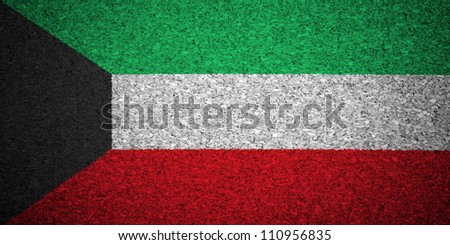 The Kuwaiti flag painted on a cork board.