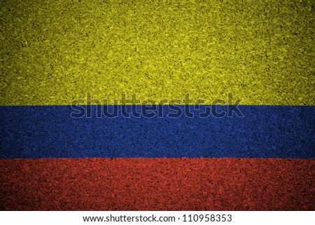 The Colombian flag painted on a cork board.
