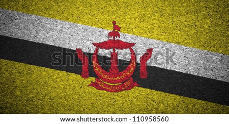 The Brunei Flag painted on a cork board.