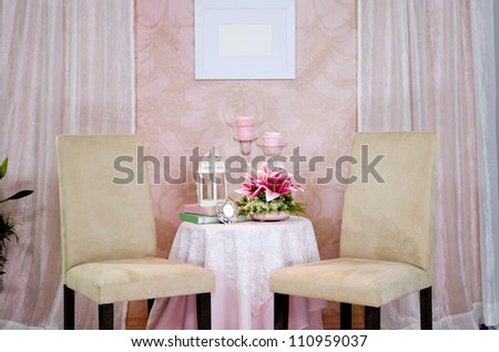 Studio setup of two chairs and coffee table