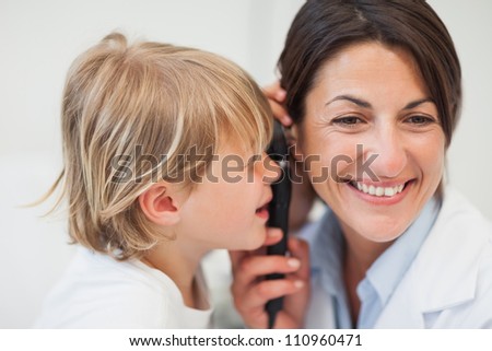 Child playing with examination tool with his doctor, Healthcare workers in the Coronavirus Covid19 pandemic